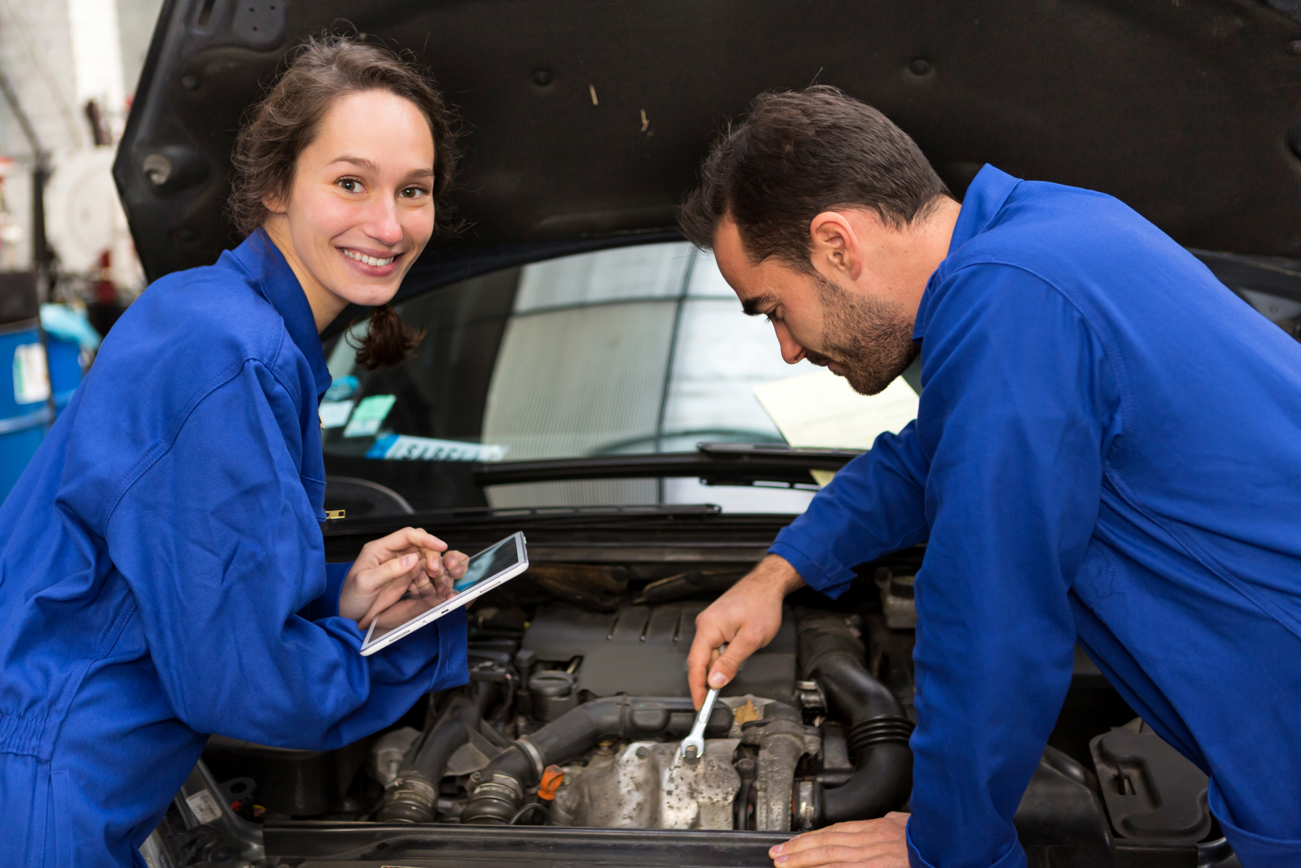 Team of mechanics working at the garage