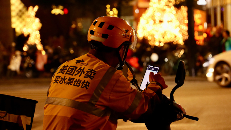 delivery man using a smartphone