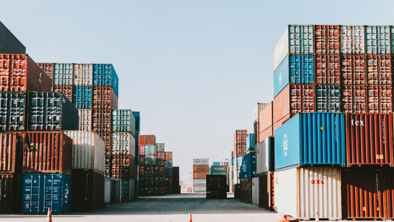 containers stored in a port with serial numbers