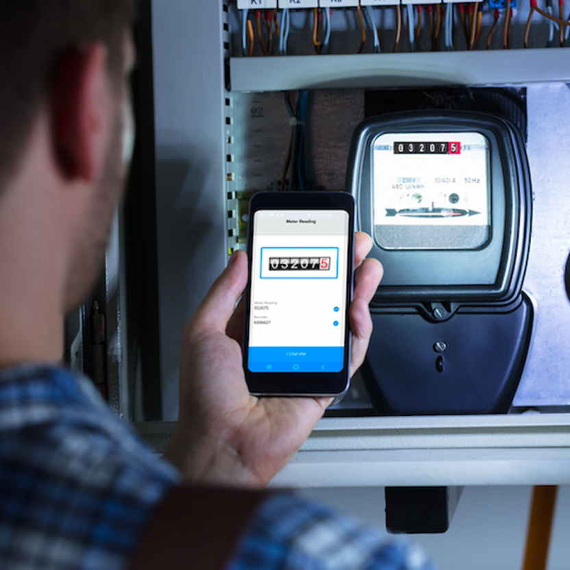 Man scanning his energy meter