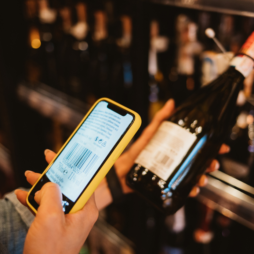 scanning the barcode of a bottle of wine with a smartphone