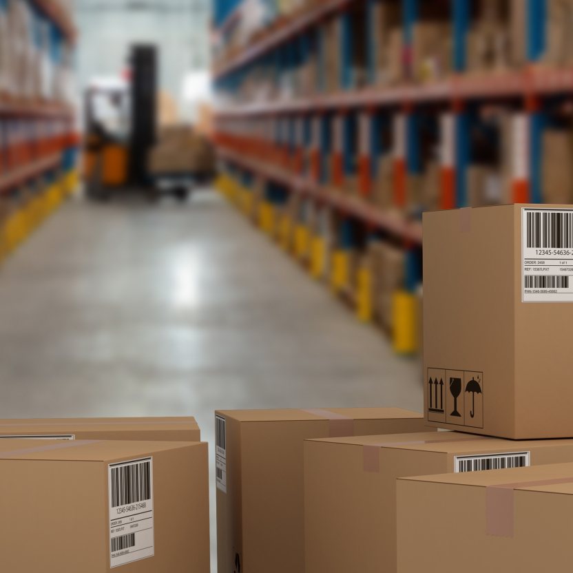 large warehouse with multiple barcode boxes in focus