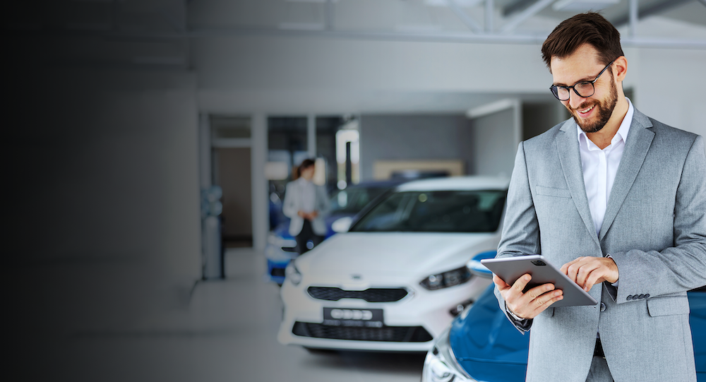 sales man in a car dealership