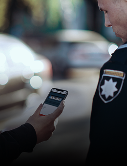 2 police officers scanning license plate with a smartphone