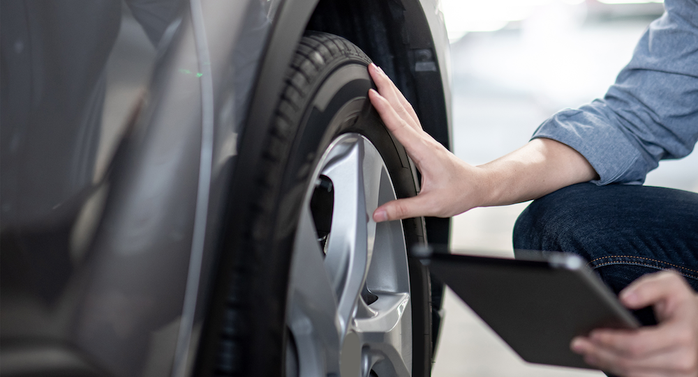 Person using a mobile Tire scanner for tire services