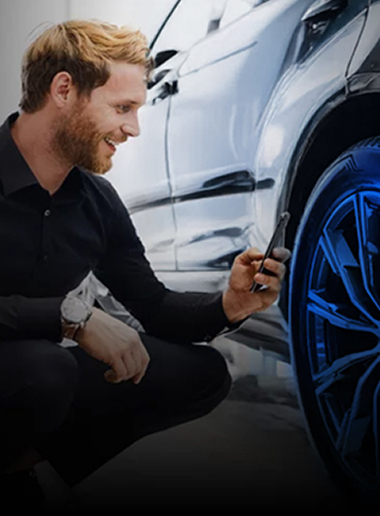 Man scanning a tire