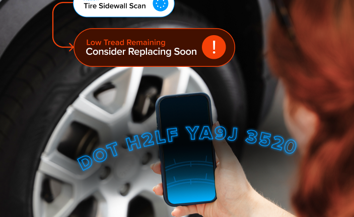 A persone scanning tire information with a smartphone