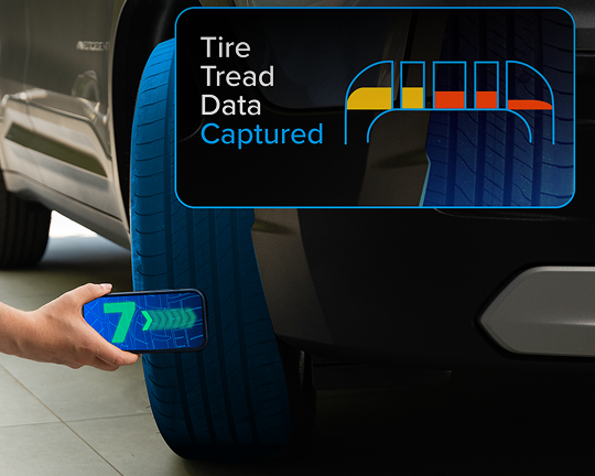 A smartphone performing a tire tread scan